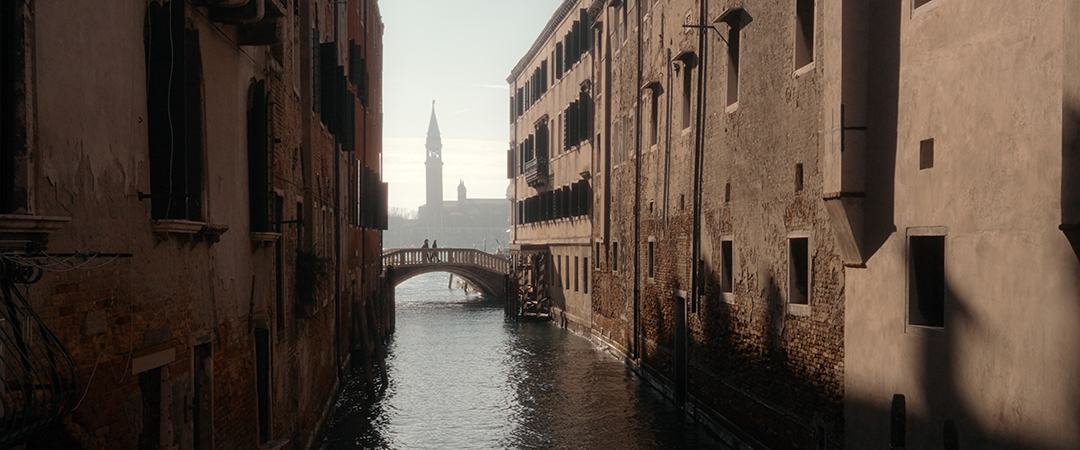 Crossing a Venetian bridge